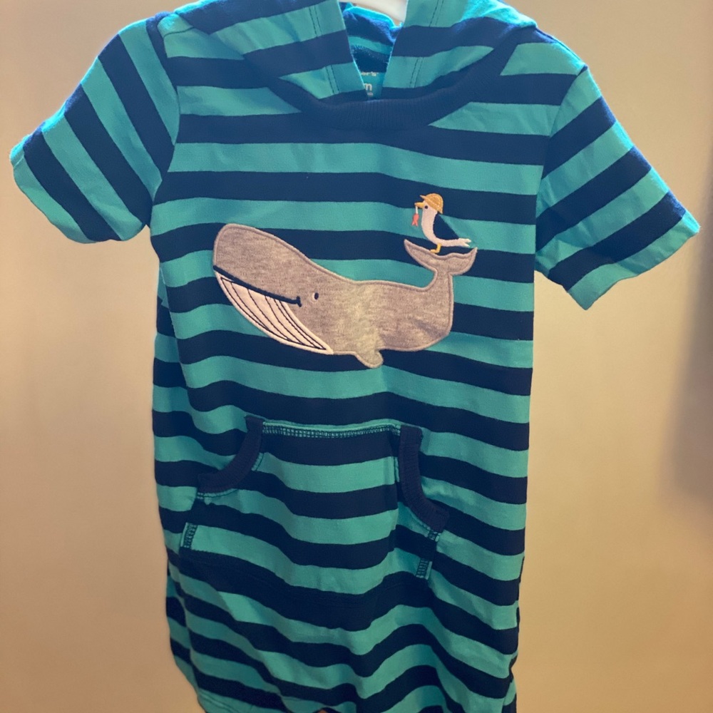 Blue and teal striped jumper featuring a whale